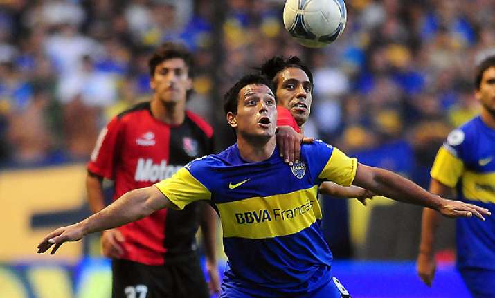 riquelme seals boca win over newell s