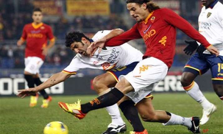 roma striker osvaldo fined banned for hitting lamela