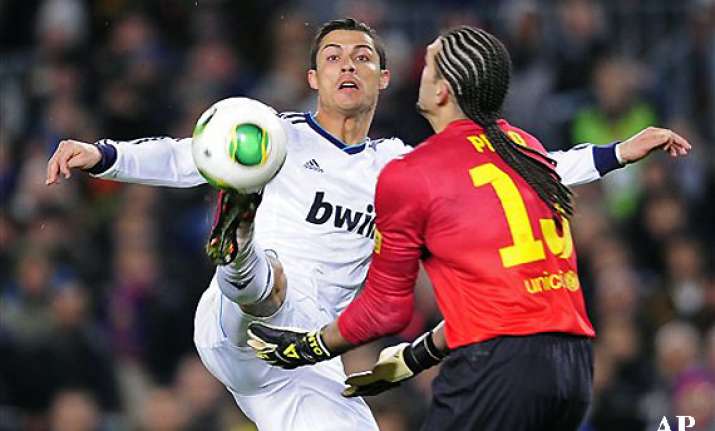 ronaldo leads madrid past barca to make copa final
