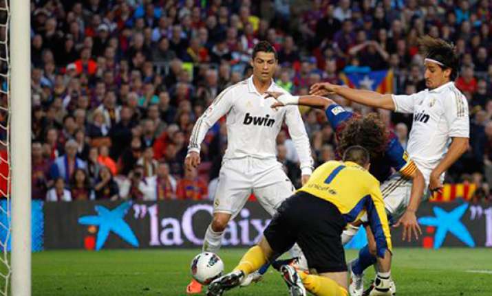 ronaldo strike helps real madrid stun barcelona