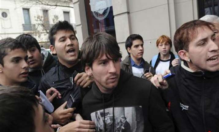 schoolboy throws punch at messi