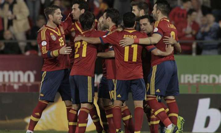 spain beats belarus 1 point away from world cup