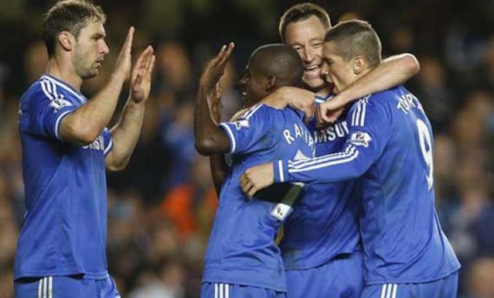 torres raises chelsea title hopes