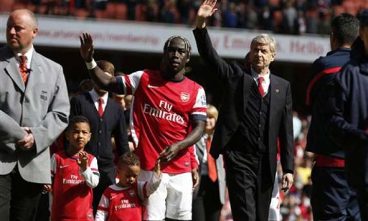 wenger says he ll be back at arsenal next season