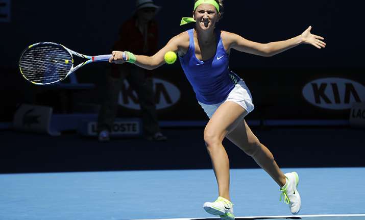 azarenka breezes through center court opener