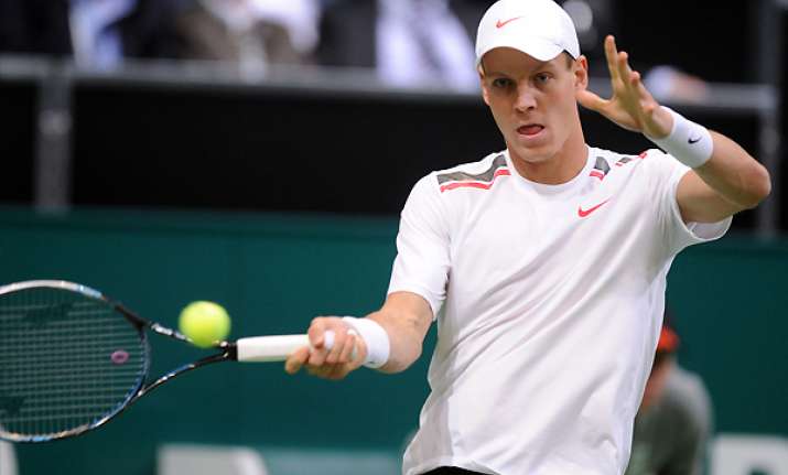 berdych through at abn amro as baghdatis retires