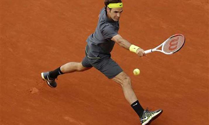 djokovic federer move on at french open
