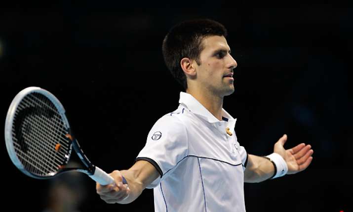 djokovic recovers to beat berdych at atp finals
