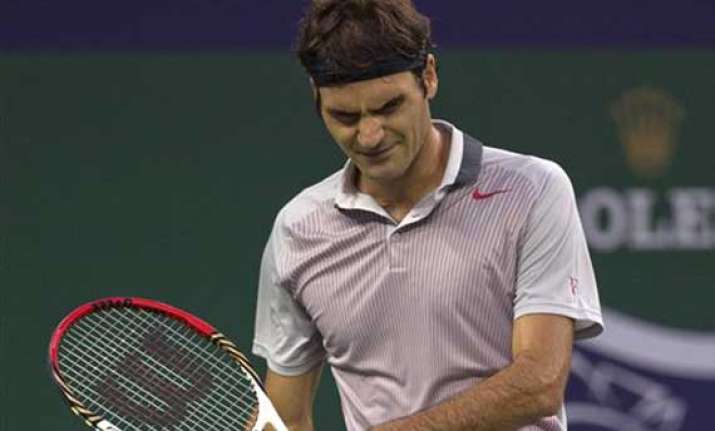 federer ousted by monfils in shanghai masters