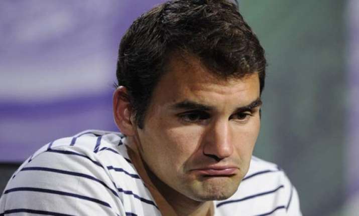 federer reflects on mistakes of playing injured