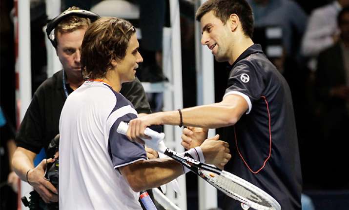 ferrer stuns tired djokovic 6 3 6 1 at atp finals
