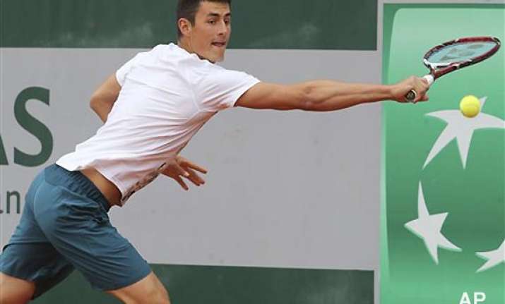 french open dad banned tomic retires from 1st match