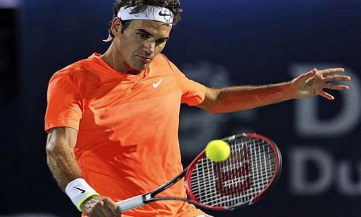 defending champ roger federer wins gulbis loses again at
