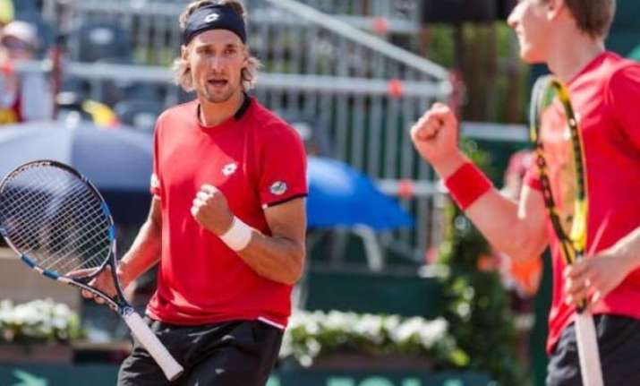 belgium beat canada to reach davis cup semis