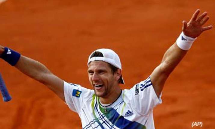melzer upsets djokovic gets nadal next