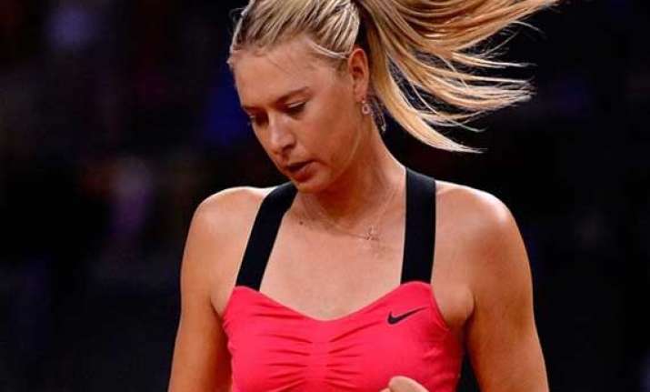sharapova survives scare to progress at stuttgart