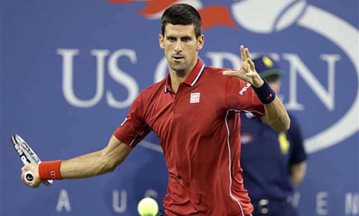 us open top seeded novak djokovic coasts in opener