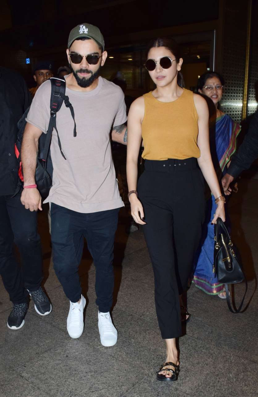 Anushka Sharma flies back to Mumbai with husband Virat Kohli. See pics