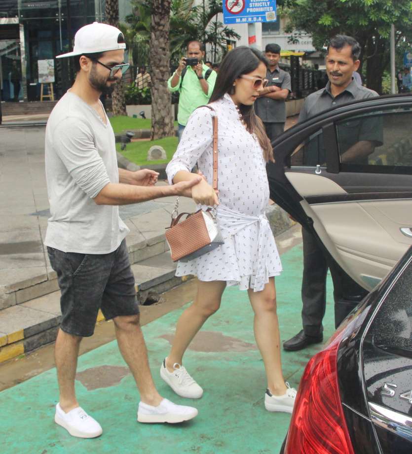 Mira Rajput flaunts baby bump as she walks hand-in-hand with hubby ...