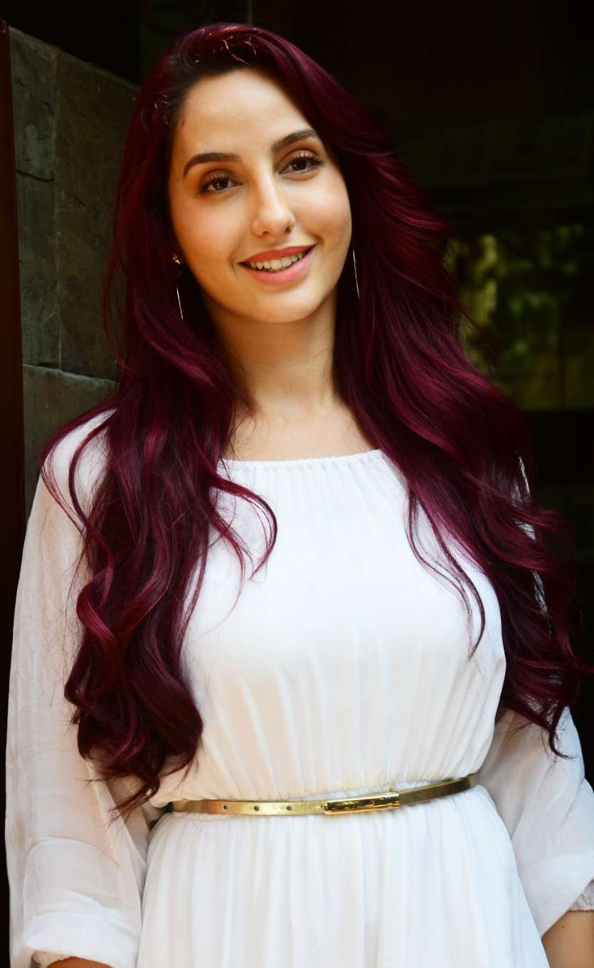 Bharat actress Nora Fatehi looks ethereal in white summer dress and burgundy  hair. See pictures