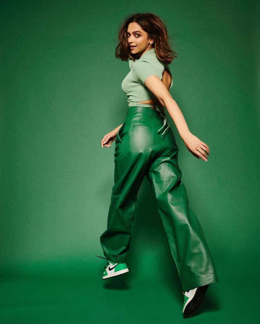 Deepika Padukone sets the internet on fire with this outfit. Sneakers, a crop top, leather pants, and that too all in green.