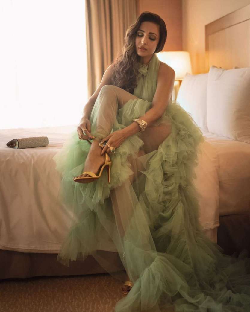 Malaika Arora is a smoking hit in this green long gown, perfect for attending summer parties and weddings. 