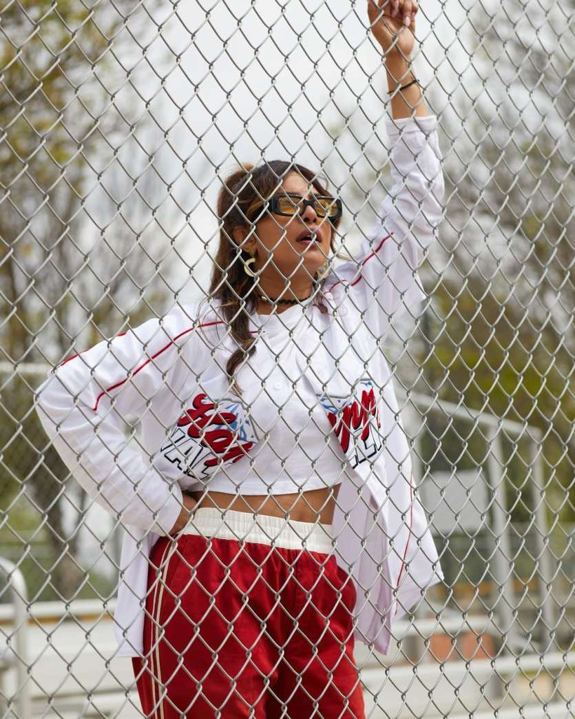 Priyanka posed for the picture from behind the field net. She was seen giving a surprising reaction to the intense game.