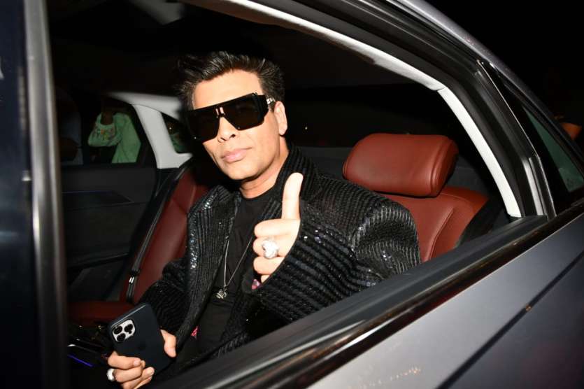 Karan Johar arrived at the post-wedding bash hosted by Alia Bhatt and Ranbir Kapoor in Vastu in a shimmery black dinner jacket