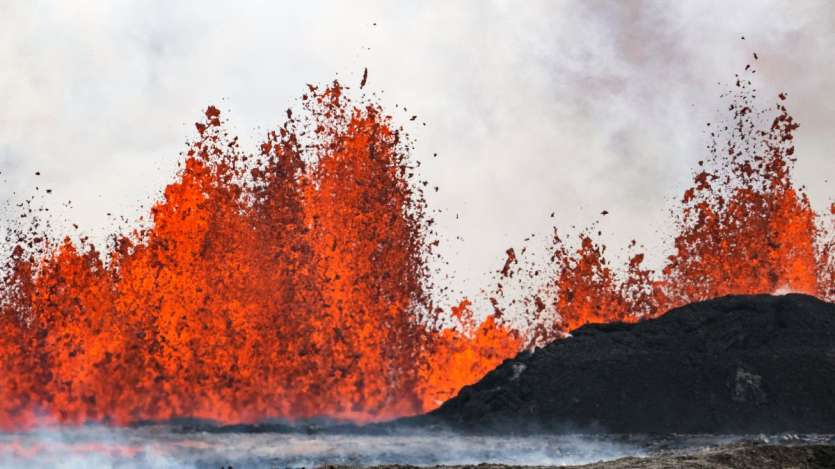 Iceland volcano spews red streams of lava toward an evacuated town I HORRIFIC PICS