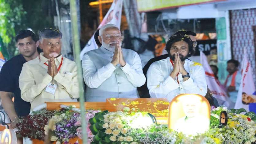 PM Modi along with TDP chief N Chandrababu Naidu and Jana Sena Party chief Pawan Kalyan greets their supporters during a roadshow in Vijayawada.