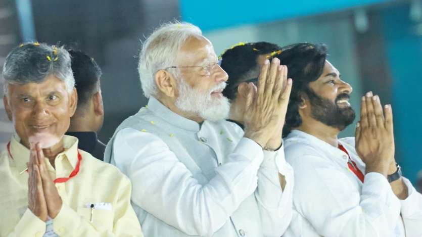 Prime Minister Narendra Modi, TDP chief N Chandrababu Naidu and Jana Sena Party chief Pawan Kalyan seek votes for the NDA during a roadshow in Vijayawada.