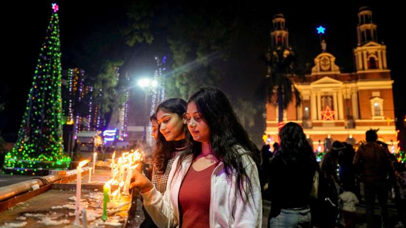 On Christmas, people gather at Sacred Heart Cathedral in New Delhi to light candles, embracing the spirit of the season. The serene atmosphere and glowing lights add to the festive charm of the celebration.