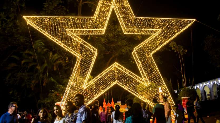 People flock to Bishops House in Kochi to admire the giant star installed for Christmas celebrations. The stunning display has become a popular attraction, drawing visitors eager to experience the festive spirit.