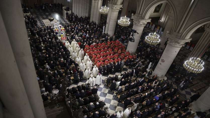 During the reopening, clergy walked down the central isle after the service in Notre Dame Cathedral.