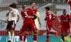 Liverpool's Diogo Jota, centre, is congratulated by