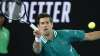 Serbia's Novak Djokovic makes a forehand return to France's