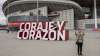 A woman takes a snapshot in front Atletico Madrid's Wanda
