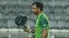 Pakistan's batsman Fakhar Zaman leaves the field after
