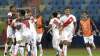 Peru's players celebrate defeating Paraguay 4-3 in a