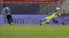 Colombia's goalkeeper David Ospina, right, stops a penalty