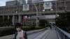 Tokyo's drinkers drown frustrations over virus limits, Games