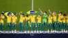 Players of Brazil celebrate at the podium after defeating Spain in the men's soccer final 
