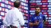 Virat Kohli of India looks on as they are interviewed following the ICC Men's T20 World Cup match be