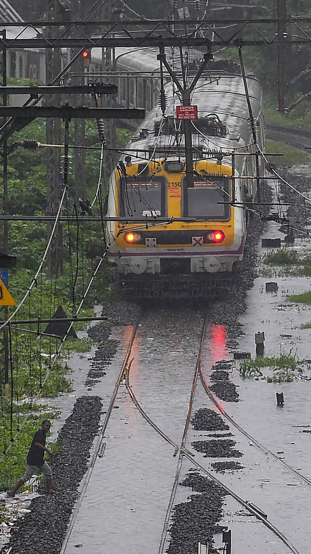 Local train runs on flooded tracks between Kurla and Tilak Nagar amid heavy rains.&amp;nbsp;