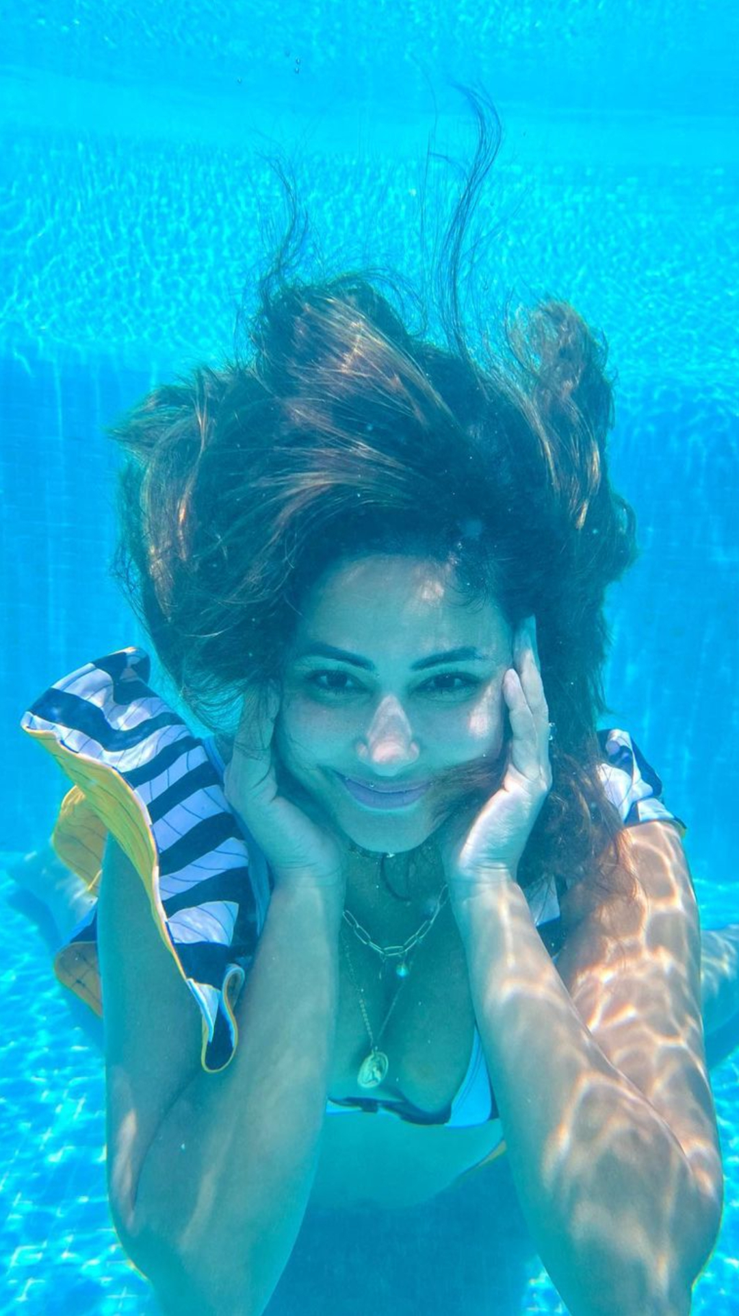 Hina Khan slays in striped bikini as she shares underwater pics from the Maldives