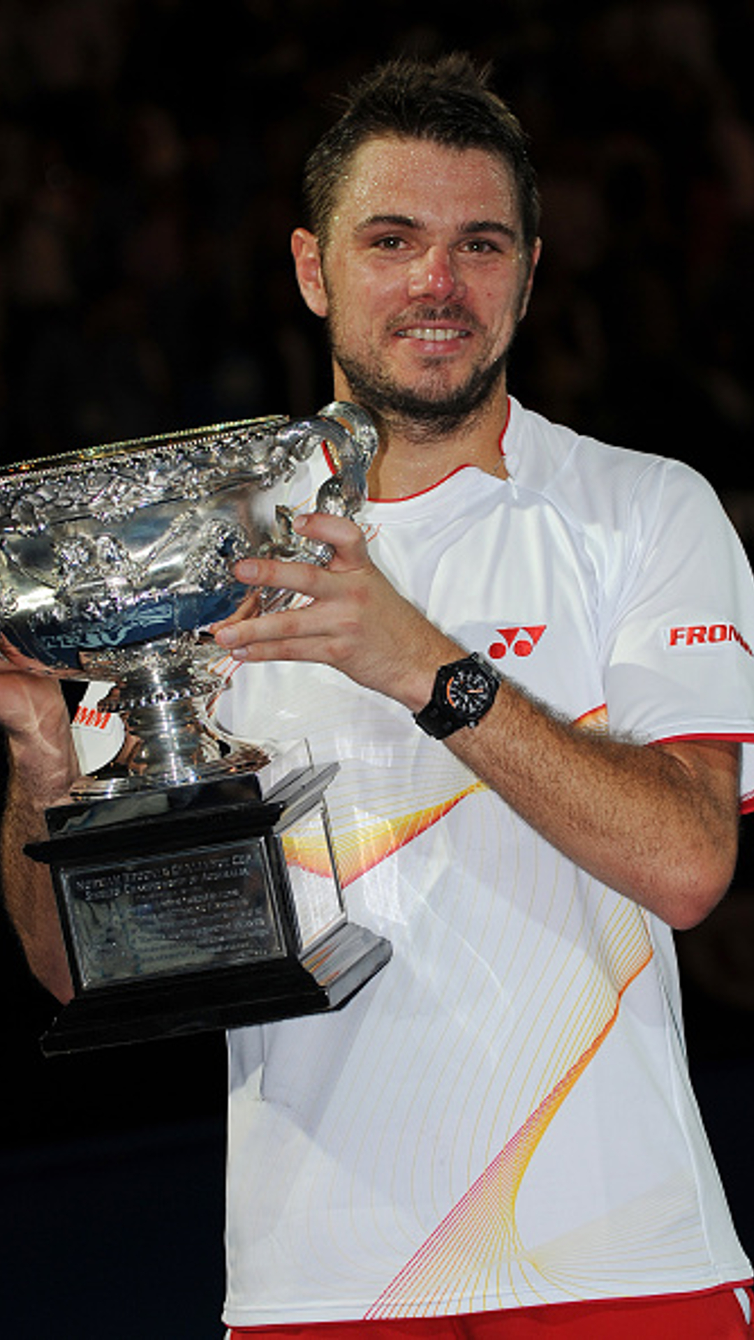 Stanislas Wawrinks held the Norman Brooks trophy in 2014 after he beat Novak Djokovic