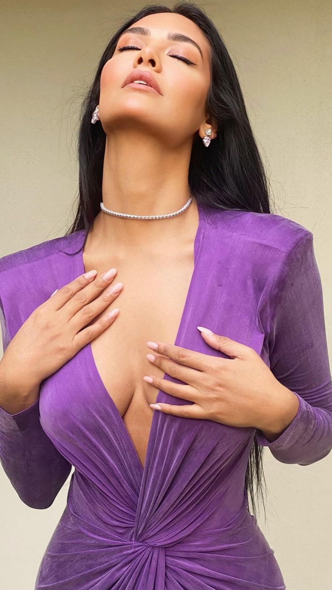 Esha Gupta's viral plunging neckline photos in thigh-high slit outfits.