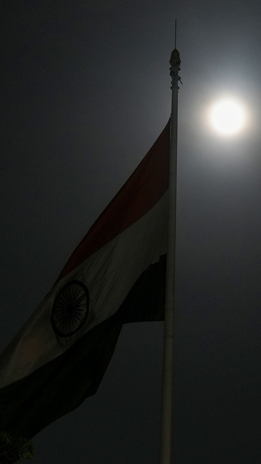 Supermoon behind the Indian tricolours, in New Delhi