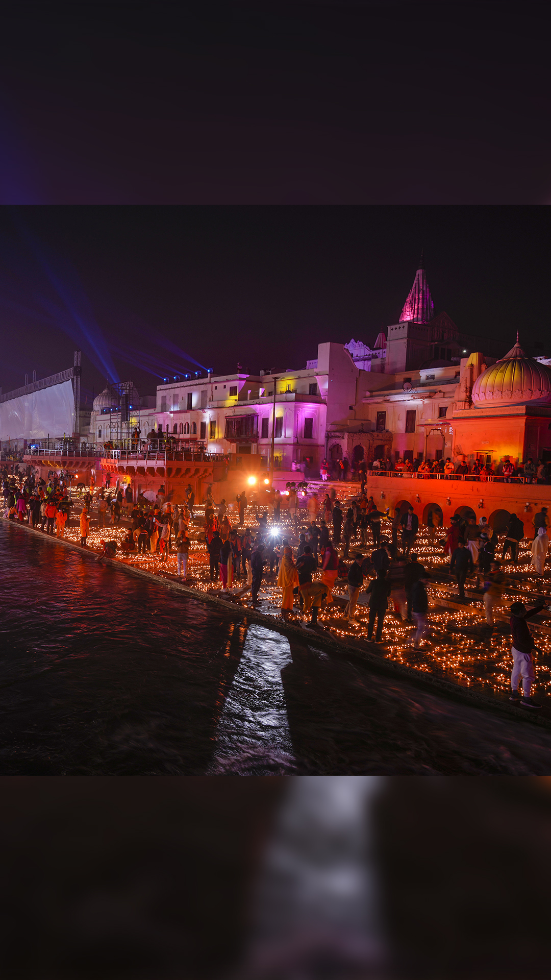 Devotees at the illuminated Saryu Ghat with earthen lamps (diyas) to mark Ram Temple's 'Pran Pratishtha' in Ayodhya
