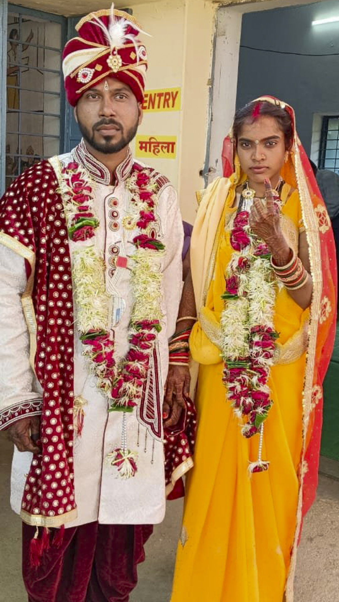 A newly-wedded couple at a polling station after casting their votes for the first phase of Lok Sabha elections in Balaghat district,